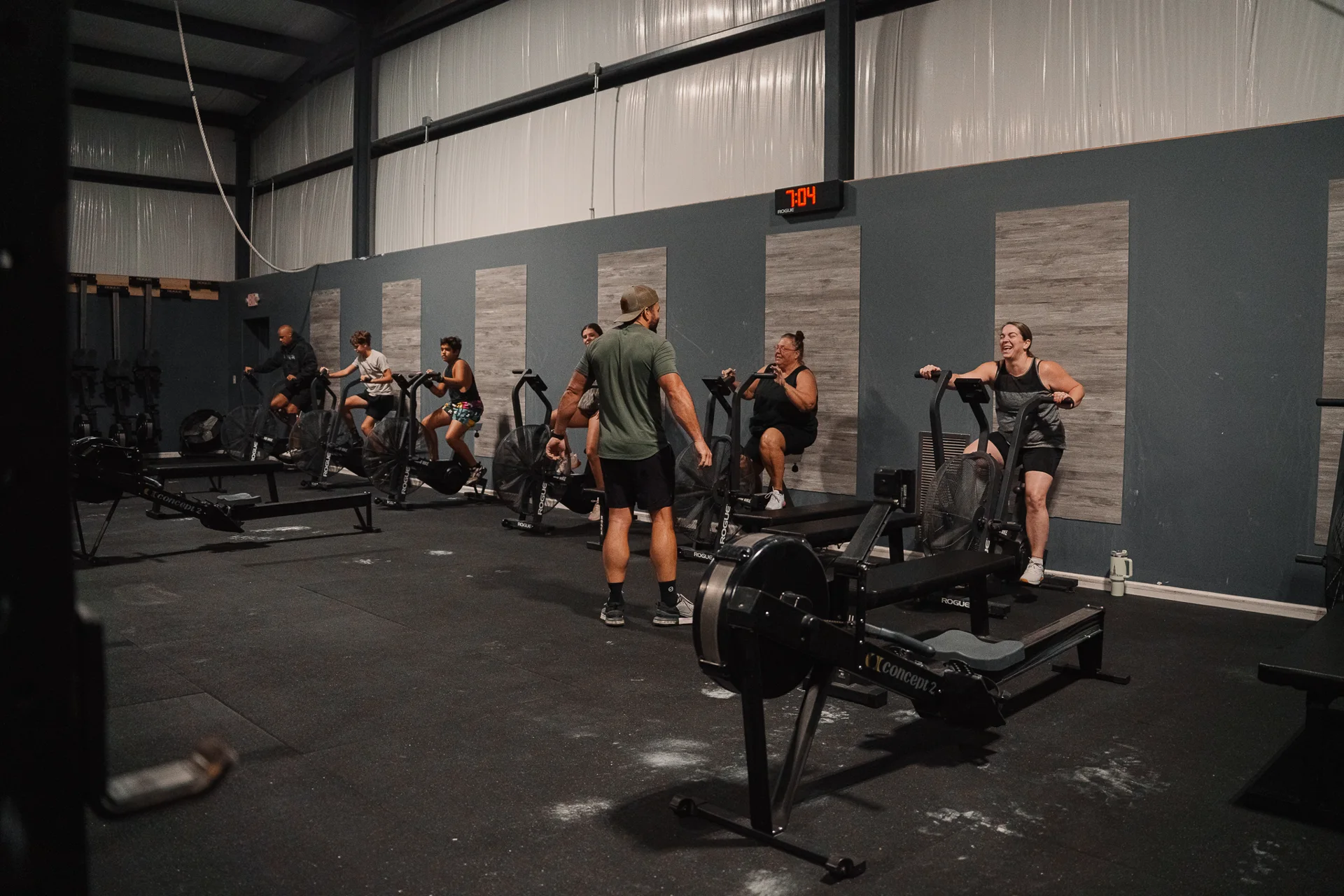 Coach guiding members on exercise bikes at CrossFit Fig in Grain Valley, MO